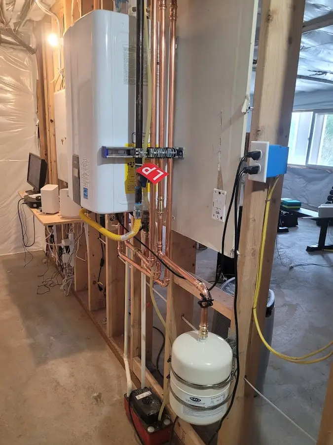 Licensed plumber repairing a kitchen sink in Dundalk